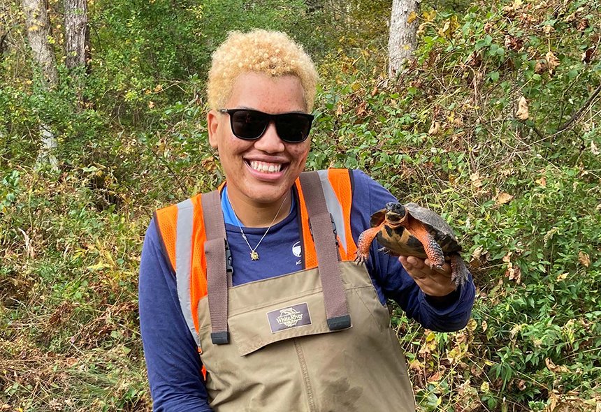 URI graduate student Chloe Johnson holds a wood turtle
